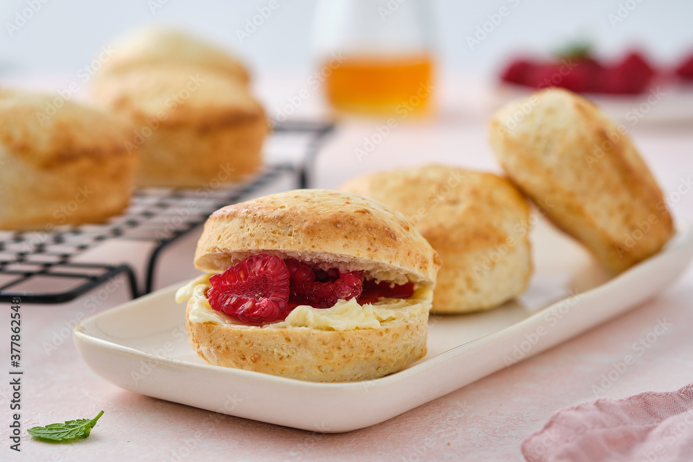 Traditional British Scones with clotted cream, raspberry jam. Scones with raspberry jam Traditional British Scones with clotted cream, raspberry jam. Scones with raspberry jam