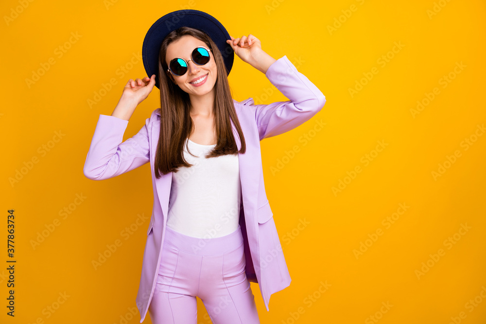 Portrait of her she nice-looking attractive lovely charming winsome cheerful cheery feminine teenage girl touching hat posing isolated over bright vivid shine vibrant yellow color background Portrait of her she nice-looking attractive lovely charming winsome cheerful cheery feminine teenage girl touching hat posing isolated over bright vivid shine vibrant yellow color background