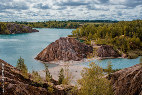 Konduki (Conduky) village, Tula region, Romancevskie mountains, Abandoned Ushakov quarries. Turquoise water lakes and the mud erosion of the soil looks like mountains. Beautiful natural landscape. photo