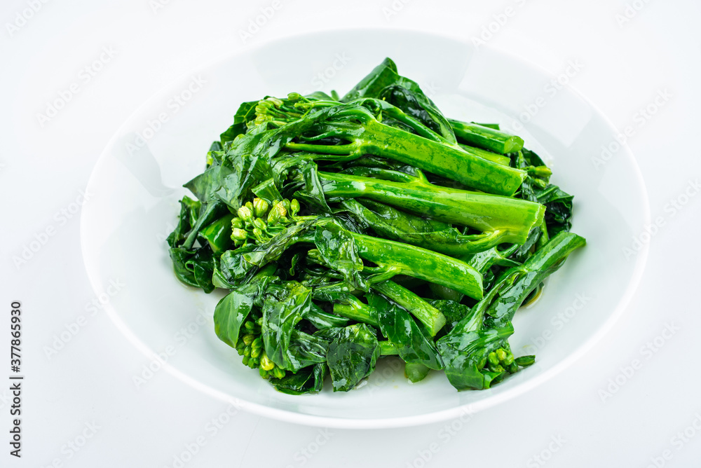 Fried kale cabbage heart in a dish on white background Fried kale cabbage heart in a dish on white background