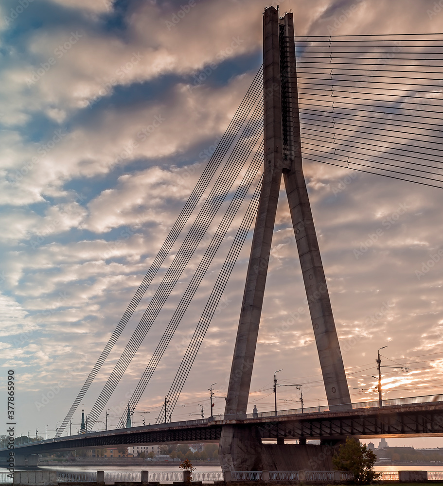 Fototapeta premium Morning view on the cable stayed bridge and ancient buildings of old European city
