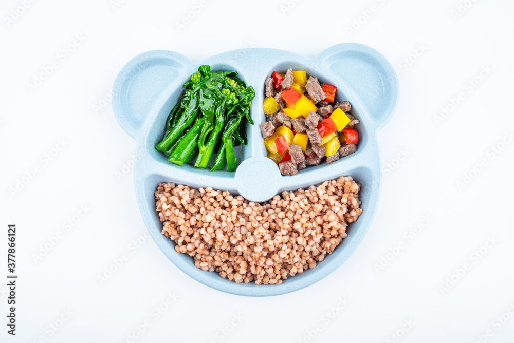 Nutritional meal for children on a plate on white background Nutritional meal for children on a plate on white background
