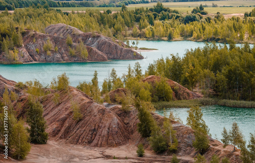 Konduki (Conduky) village, Tula region, Romancevskie mountains, Abandoned Ushakov quarries. Turquoise water lakes and the mud erosion of the soil looks like mountains. Beautiful natural landscape. photo