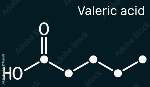 Valeric acid, pentanoic acid or valerate molecule. Skeletal chemical formula on the dark blue background photo