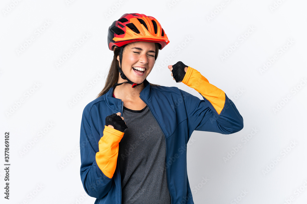 Young cyclist brazilian girl isolated on white background celebrating a victory Young cyclist brazilian girl isolated on white background celebrating a victory