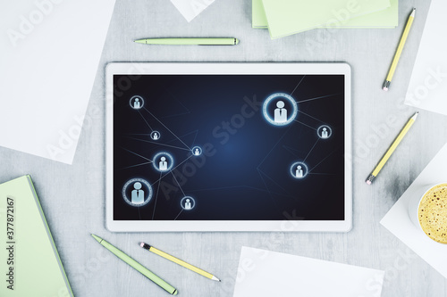 Modern digital tablet monitor with social network icons concept. Marketing and promotion concept. Top view. 3D Rendering