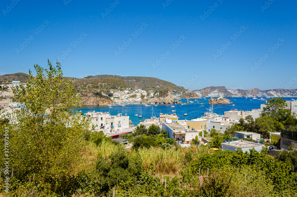 Island of Ponza, Italy. August 16th, 2017. Panoramic image of a bay with white houses and boats. Italian Summer.