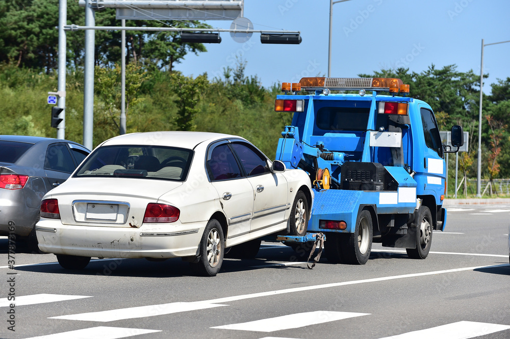 Tow Truck Towing a breakdown car Tow Truck Towing a breakdown car