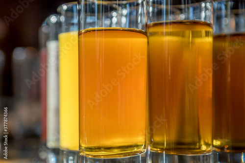 Glasses of fresh juice stand in a row