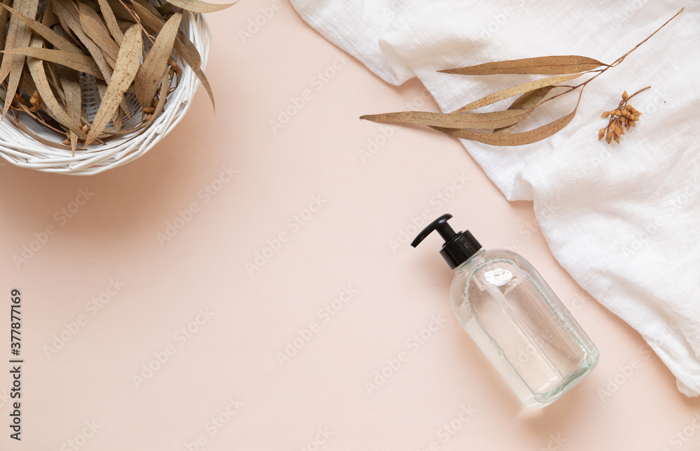 Transparent bottle mockup on pastel pink background with eucalyptus leaves. Transparent bottle mockup on pastel pink background with eucalyptus leaves.