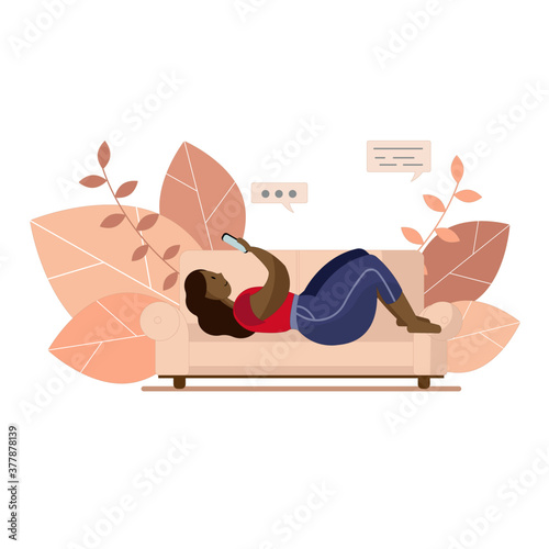 An illustration of a black woman laying on a couch with her smartphone. Curvy lady relaxing home. Leaves in the background.