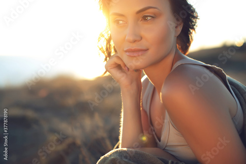 Beautiful woman. Portrait of a beautiful young girl at sunset. High quality photo.