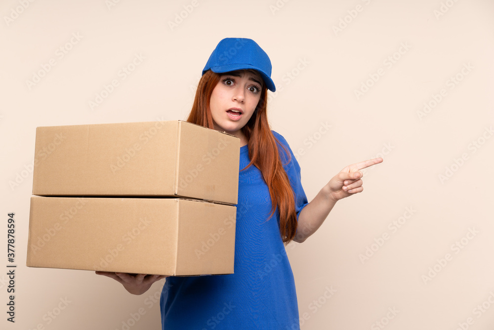 Young teenager delivery girl over isolated background pointing to the laterals having doubts Young teenager delivery girl over isolated background pointing to the laterals having doubts