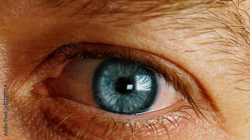 Close shot of the human eye. The eye of a man.