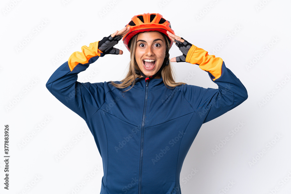 Young hispanic cyclist woman isolated on white background with surprise expression Young hispanic cyclist woman isolated on white background with surprise expression