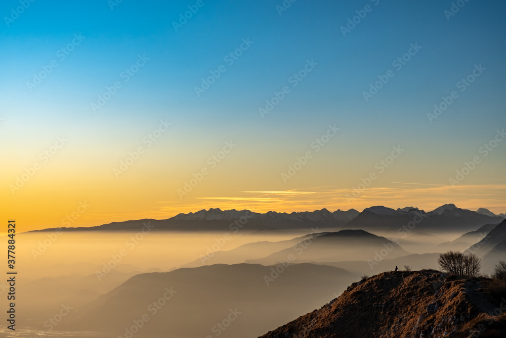 Obraz premium Winter sunset from an alpine peak of Friuli-Venezia Giulia