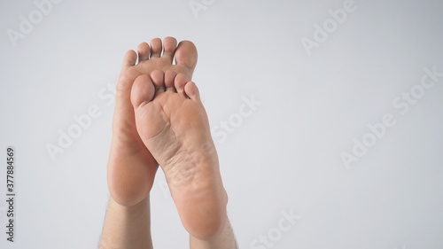 close up of man sole of foot on white background photo