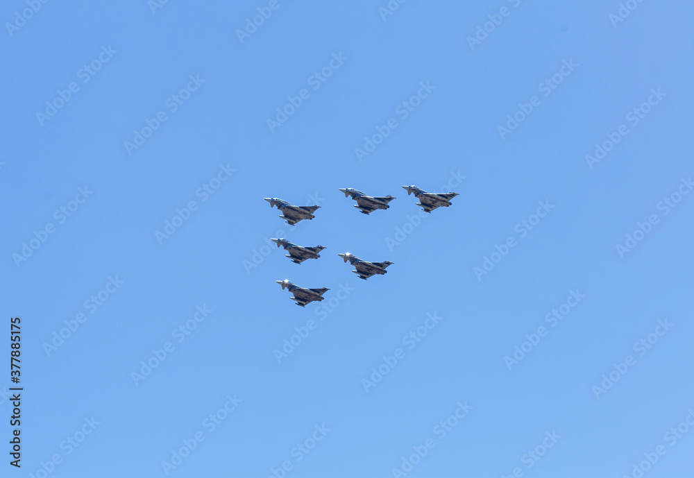 Modern armed military fighter jets flys in formation through the sky. Modern armed military fighter jets flys in formation through the sky.