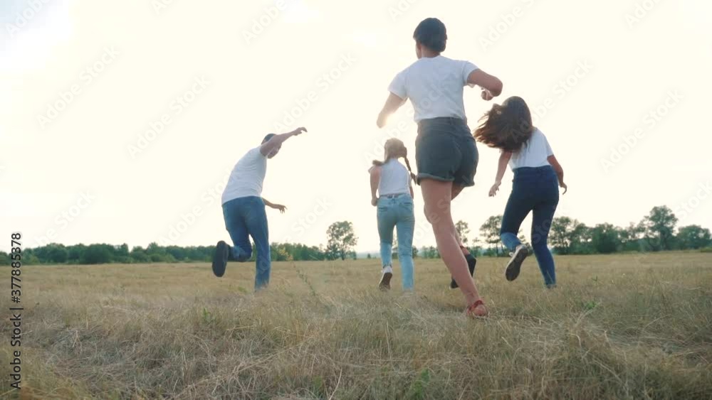 happy family children kids together run in park at sunset silhouette. people lifestyle in park concept mom a dad daughter and son joyful run. parents and little baby child fun summer vacation running happy family children kids together run in park at sunset silhouette. people lifestyle in park concept mom a dad daughter and son joyful run. parents and little baby child fun summer vacation running