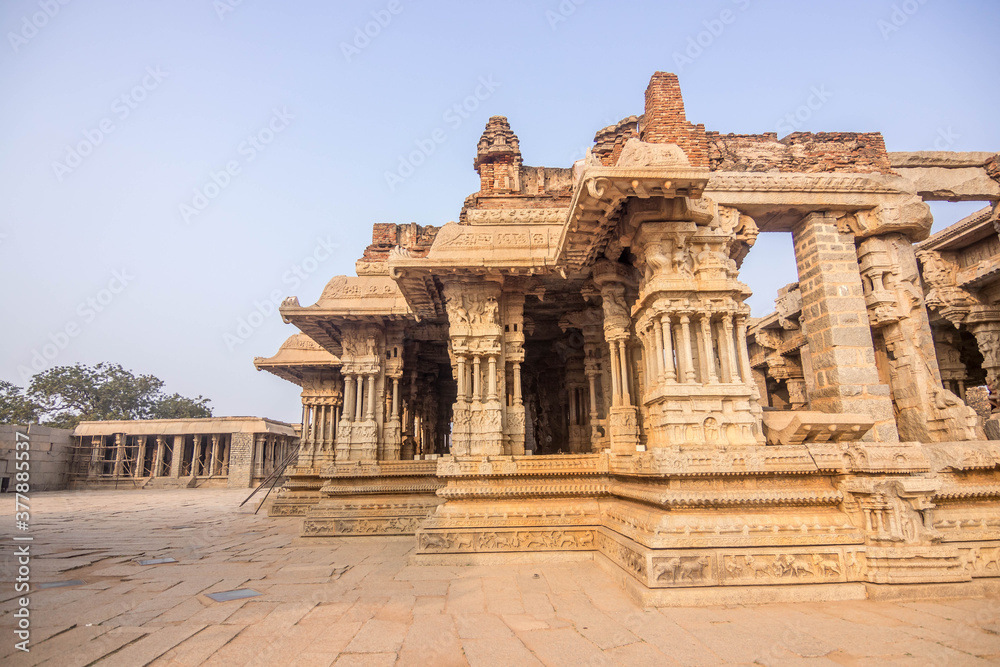 stone chariot vijaya vithala temple main attraction at hampi, karnataka, india
