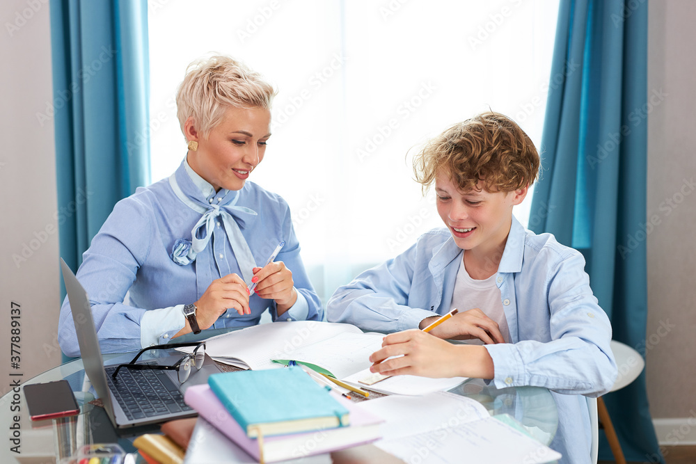 young intelligent teacher explain math or geometry to student, female tutor came at home, enjoy sharing knowledge with boy young intelligent teacher explain math or geometry to student, female tutor came at home, enjoy sharing knowledge with boy