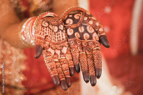 Indian Bride getting ready for the marriage with mehndi on her hand sambalpur,orrisa,india 02082019 photo
