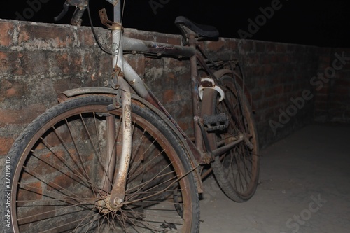 old bicycle in front of a wall
