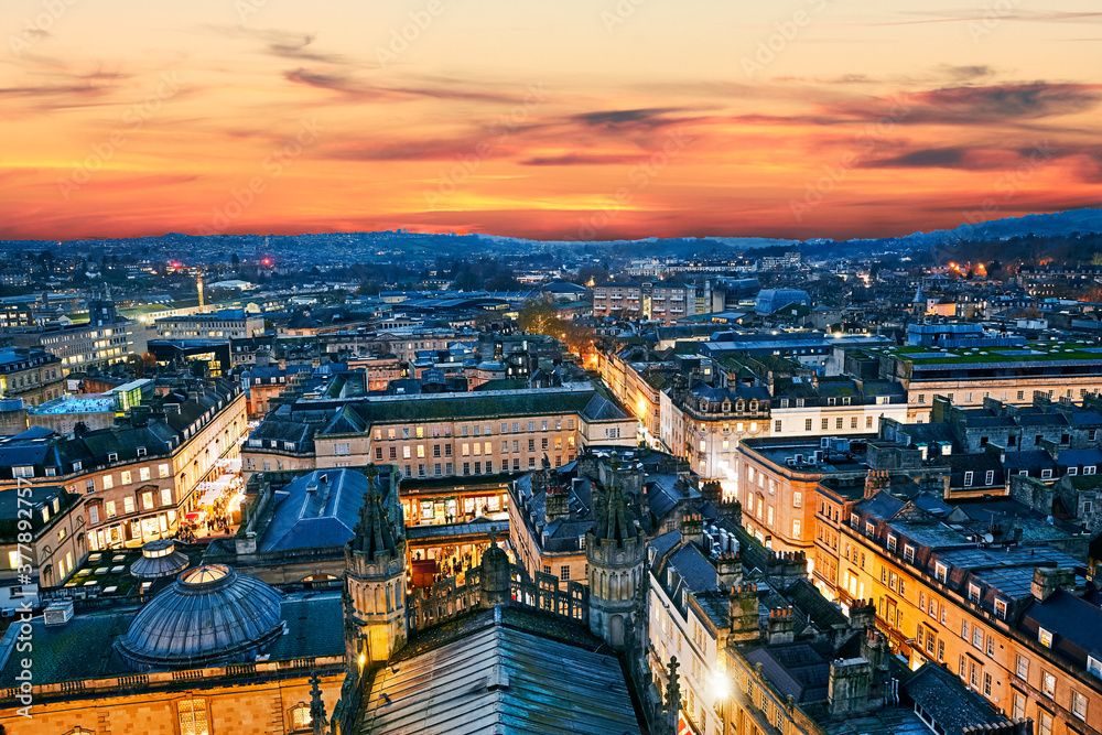 Aerial view of the skyline of Royal Bath Spa with red twilight sky