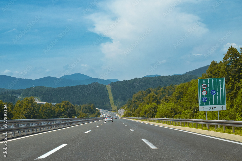 Fototapeta premium Scenic asphalt road across the green hills of Istria, Croatia