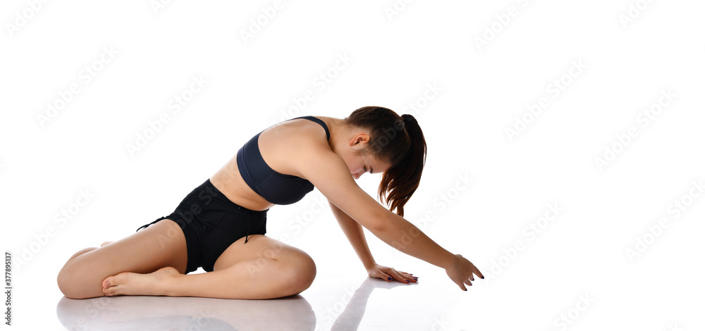 Slender woman doing sports exercises and warm-up, isolated on white background. Slender woman doing sports exercises and warm-up, isolated on white background.