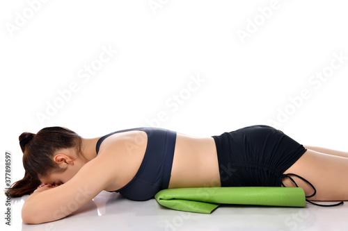 Woman relaxing on floor after exhausting workout