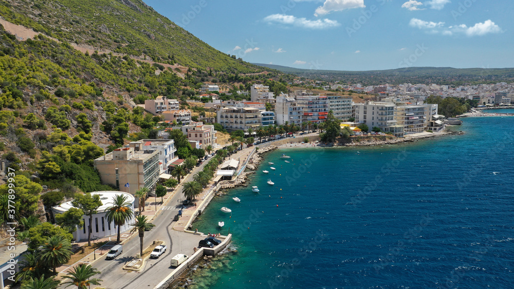 Aerial drone photo of famous seaside area, organised beach and bay of Loutraki town, Corinthian bay, Greece
