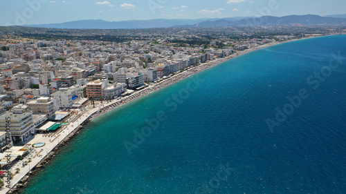 Fototapeta Naklejka Na Ścianę i Meble -  Aerial drone photo of famous seaside area, organised beach and bay of Loutraki town, Corinthian bay, Greece