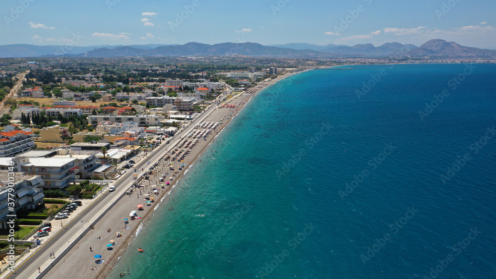 Aerial drone photo of famous seaside area, organised beach and bay of Loutraki town, Corinthian bay, Greece