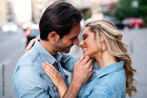 Sweet and affectionate young couple on the street