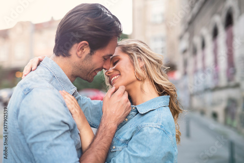 Sweet and affectionate young couple on the street