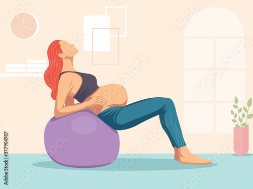 Pregnant woman doing exercise with a swiss ball