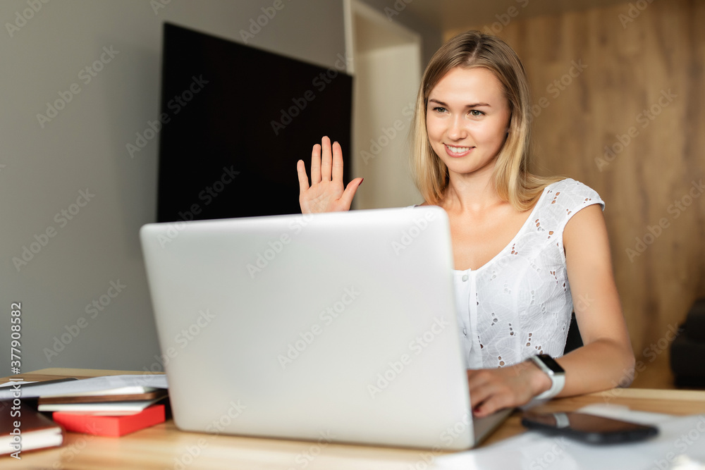 Video call, video conference with other people on laptop indoors. Online learning and work. Woman with laptop computer working at home office Video call, video conference with other people on laptop indoors. Online learning and work. Woman with laptop computer working at home office