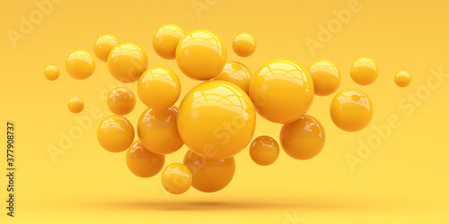 Many spheres falling on a yellow background. 3d render.