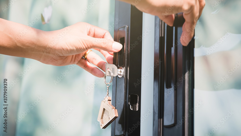 Landlord unlocks the house key for new house