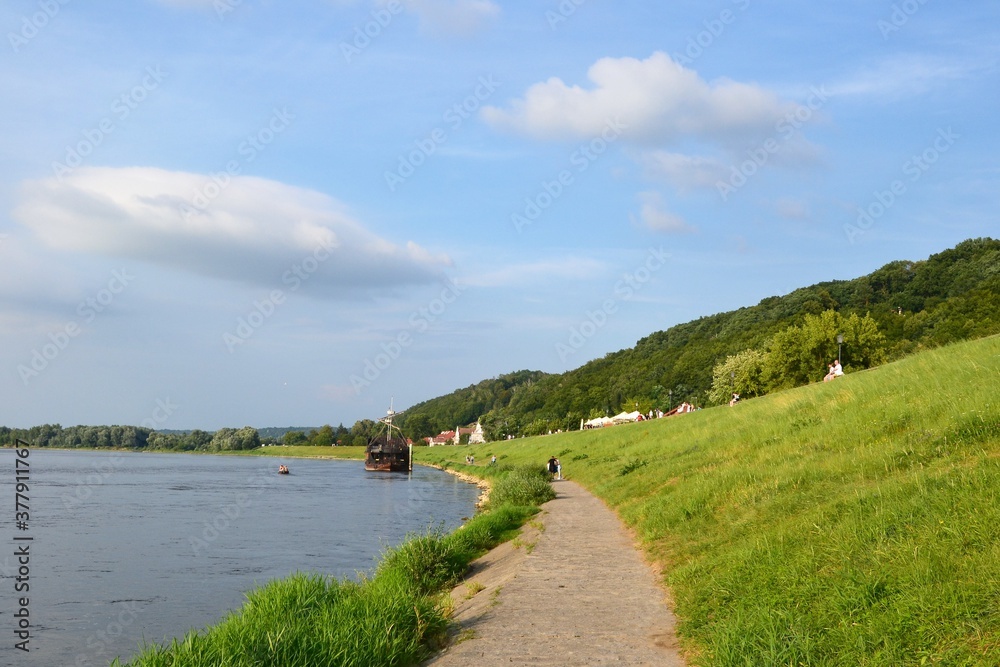 Obraz premium Kazimierz Dolny, Poland. Promenade on the banks of Vistula river. Popular place for tourists