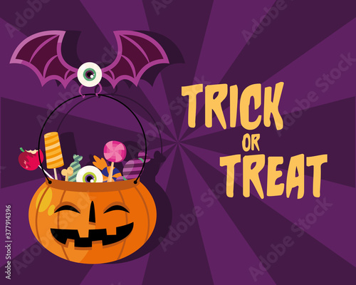 Trick or treat candies inside pumpkin with eye bat vector design