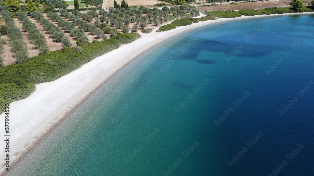 Drone flying above sea level at low altitude in Rovies Euboea Greece.