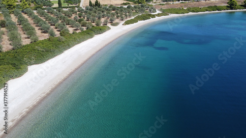 Drone flying above sea level at low altitude in Rovies Euboea Greece.