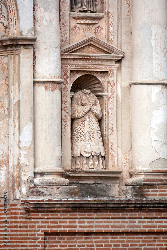 Catolic saint statue headless in the niche, Antigua Guatemala