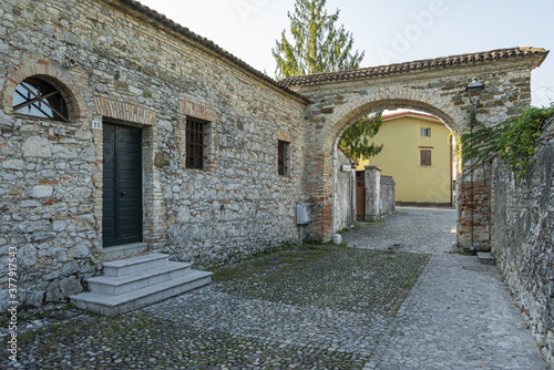 ancient entrance gate to the medieval rural village of Strassoldo photo