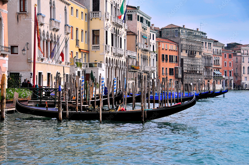 Venetian gandols against the background of old facades of houses