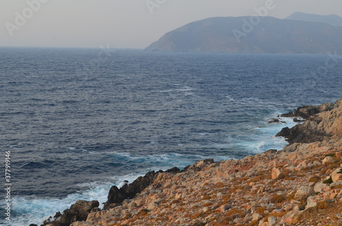 waves crashing on rocks in Greece