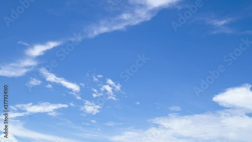 time lapse of blue sky horizontal with beautiful cirrocumulus clouds in bright clear sunny summer season, good weather for out door activity, skycap nature background photo