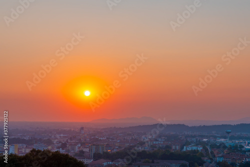 Time lapse of a sunset one hour in seven seconds. Red sunset over an urban city.